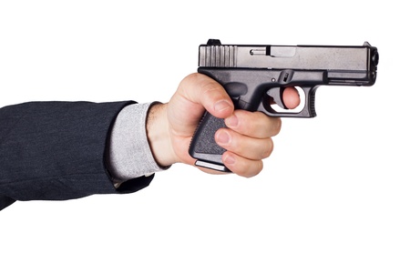 Hand with gun ready to shoot
