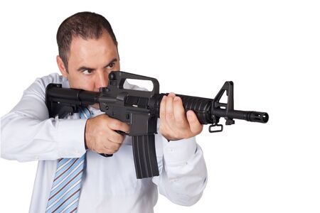 Man with a gun ready to shoot  focus on the weapon の写真素材