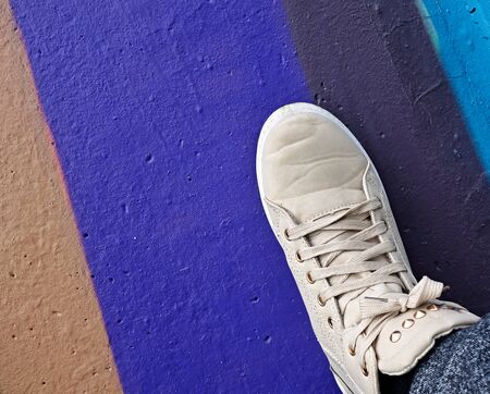 gray sneaker on a colored background