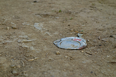 compressed drinks canister of a beverage dirt road
