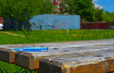 used syringe thrown in front of the dwellingの写真素材