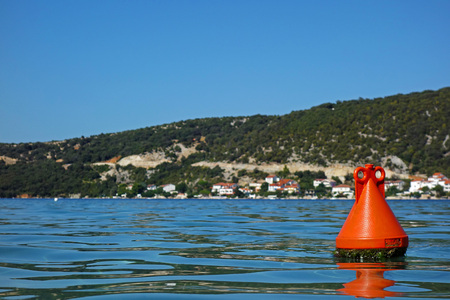 one red buoy and a seaの写真素材