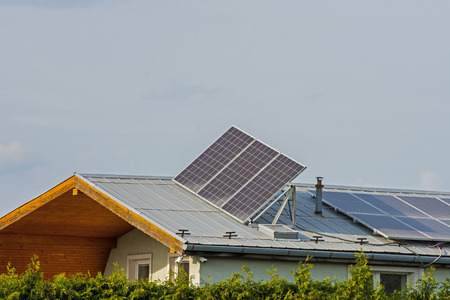 green energy, solar panels on the roof of a family house