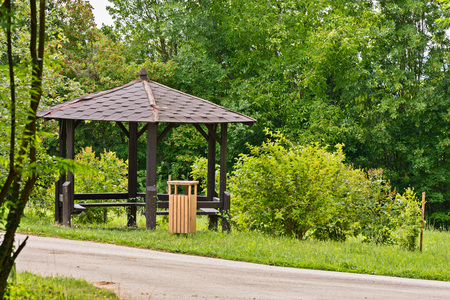 Shelter, wooden gazebo in the park and green grassの写真素材