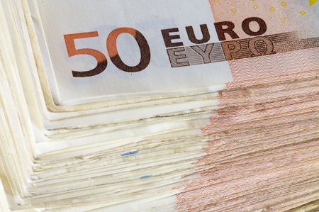 pile of fifty Euro banknotes