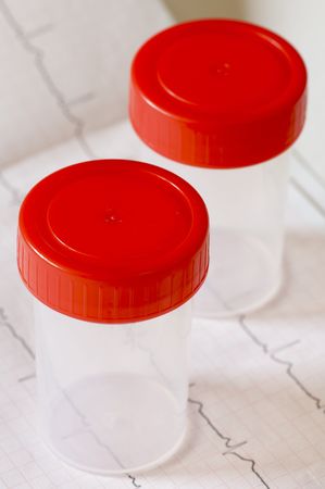 two medical containers with red capの写真素材