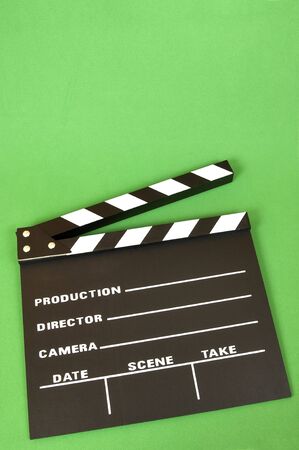 clapperboard color black on a green backgroundの写真素材