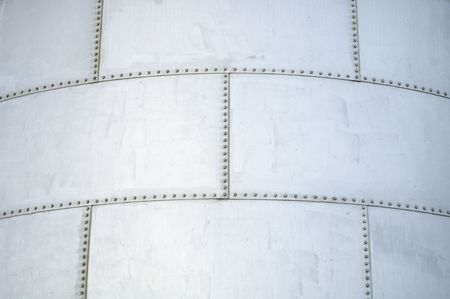 abstract detail of a metallic deposit with screewsの写真素材