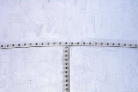 abstract detail of a metallic deposit with screwsの写真素材