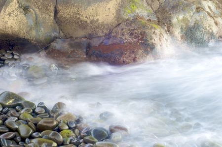 waves from a pebble beach in Madeira Island, Portugalの写真素材