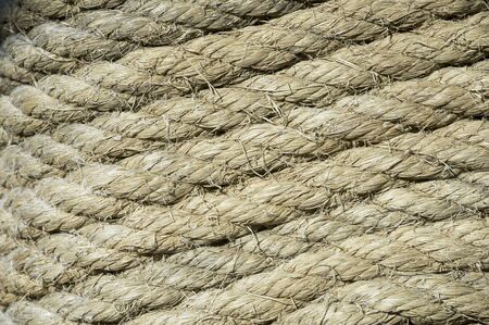 perfectly coiled rope around a poleの写真素材