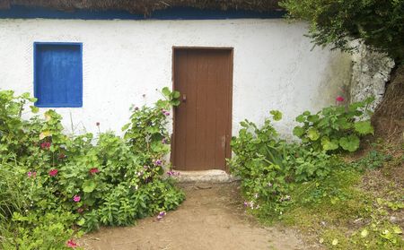 entry house with a garden and a blue windowの写真素材