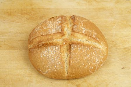 round bread on a  wooden