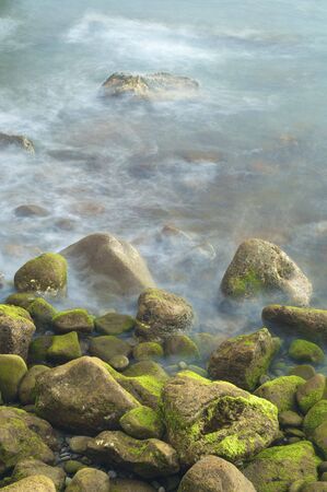 view of a shingle beach with waves in Madeira; Portugalの写真素材