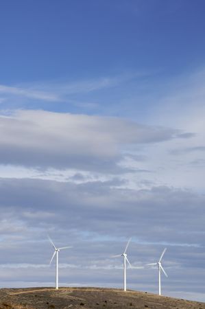 Three windmills in a hill