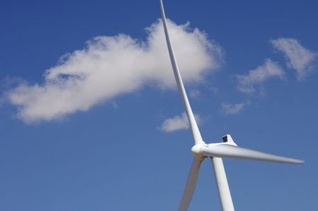 windmill with blue sky and white clouds
