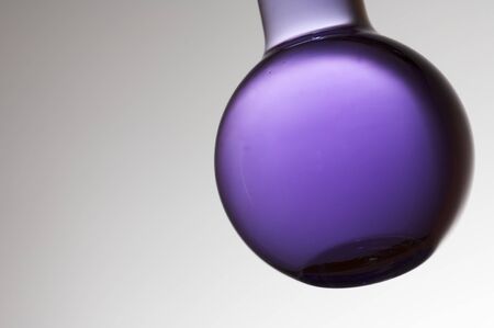 foreground of a flask with purple liquidの写真素材