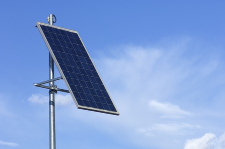 little photovoltaic panel with cloudy sky