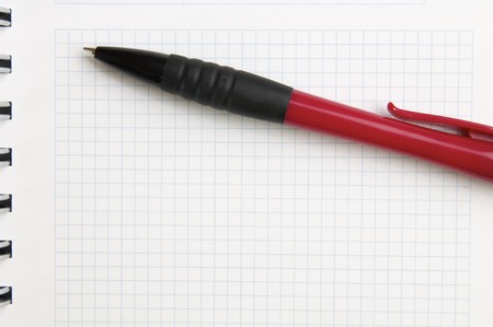 foreground of a pen and a spiral notebookの写真素材