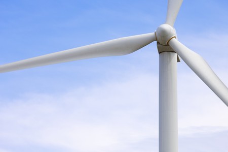foreground of the top of a windmill producing electricity