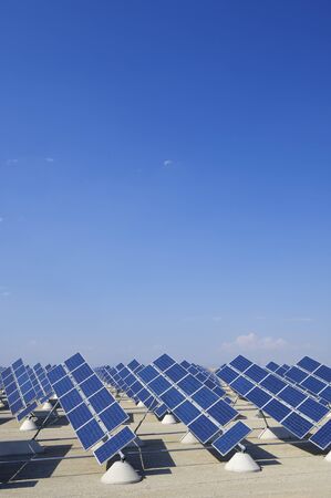 solar panels aligned to electric power production and clear skyの写真素材