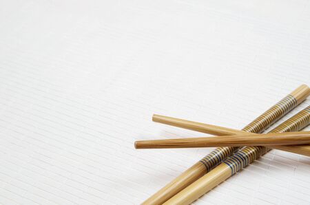 forefront of  China food sticks on a  white tableclothの写真素材