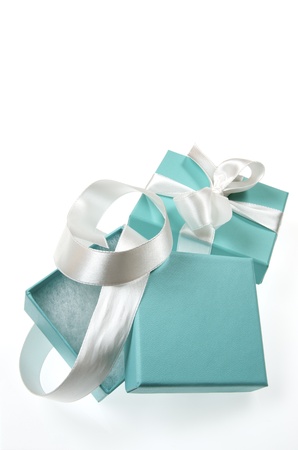 two small turquoise box tied with a white ribbonのeditorial素材