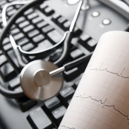 close up of a stethoscope and a computer keyboard