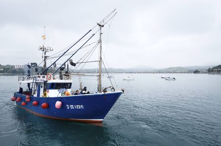 San Vicente de la Barquera, Spain, August 18, 2011: fishing boat leaving the port of San Vicente de la Barquera, Asturias,  Spainのeditorial素材