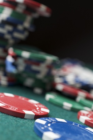 background formed for casino chips on a green feltの写真素材