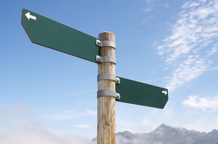 view of two wooden directional signs on a poleの写真素材