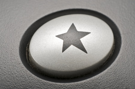 forefront of  a button with a star engraved in the centerの写真素材