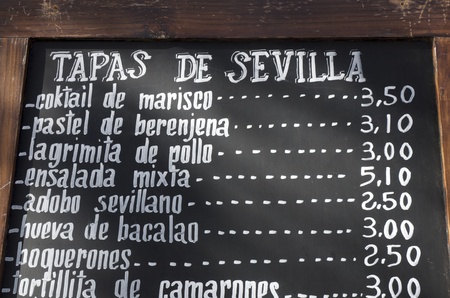foreground of a  poster of the menu in a typical Spanish restaurant, Sevilla, Andalusia, Spainの写真素材