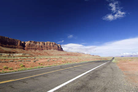 highway with blue and cloudy sky