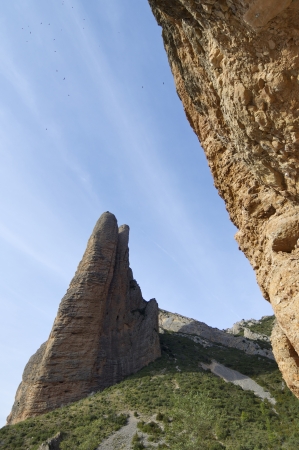 Fire Mallo in Riglos mountains and vultures flying, Huesca, Aragon, Spainのeditorial素材