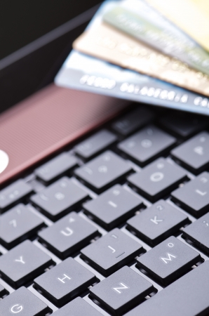 credit cards and a computer for online shoppingの写真素材