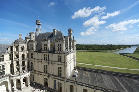 Chambord, France - August 16, 2012: Tourists walk in Chambord Castle. Built as a hunting lodge for King Francois I, between 1519 and 1539, this castle is the largest and most frequented of the Loire Valley.のeditorial素材