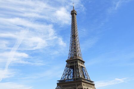 View of the Eiffel Tower with blue sky and white clouds, Paris, France