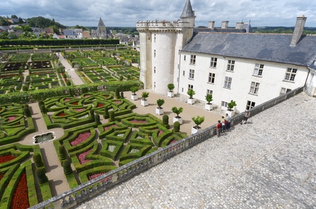 Villandry, France - August 13, 2012: Tourists walk in garden of castle of Villandry, Loire Valley, France. It was built around 1536 and after its abandonment was rebuilt by Joachim Carvallo in the early 20th century. Villandry Castle was one of the first のeditorial素材