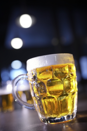 closeup of a beer mug in a barの写真素材