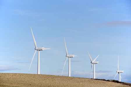 aligned windmills for renewable electric energy productionの写真素材