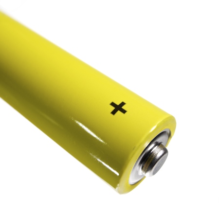 forefront of  a AA battery and white background