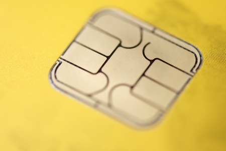 Detail of a credit card with a gold chip の写真素材