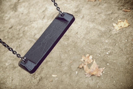 Closeup of a child swing with unfocused backgroundの写真素材