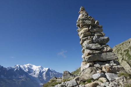Cairn, at background can be seen the Mont Blanc Peak, Mont Blanc Massif, Alps, Chamonix, Franceの写真素材