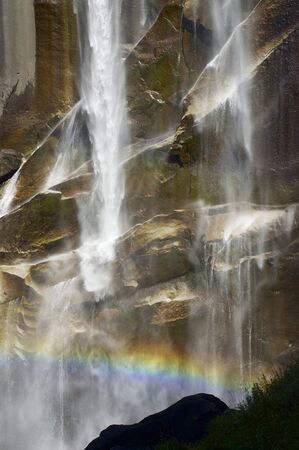 Waterfall known as Vernal Fall falling on a smooth wall of granite in Yosemite National Park, California, USAの写真素材