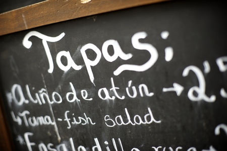 foreground of a  poster of the menu in a typical Spanish restaurant, Sevilla, Andalusia, Spainの写真素材