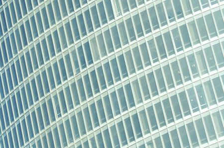 forefront of the glass facade of a skyscraper