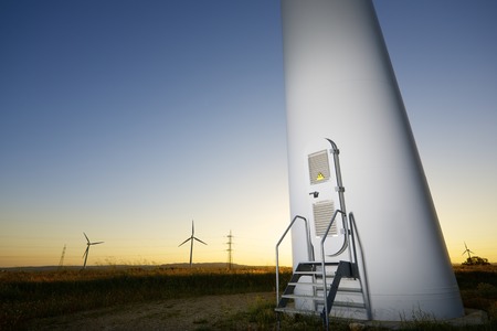 windmills for  electric power production at sunsetの写真素材