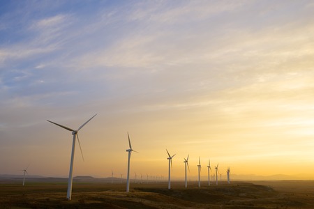 Windmills for electric power production at sunset, Pozuelo de Aragon, Zaragoza, Aragon, Spainの写真素材
